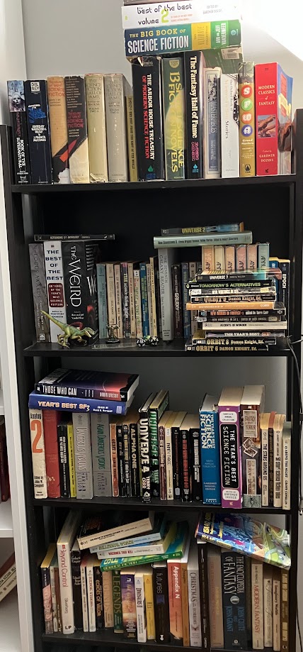 a bookshelf containing a large number of science fiction and fantasy anthologies